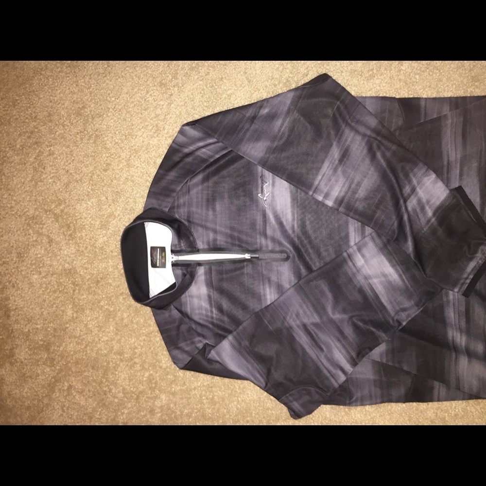 Long sleeve, 1/2 zip Greg Norman golf pullover.